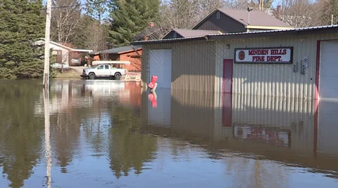 Spring flooding and rushing water after long cold snowy winter Stock Footage 39369663