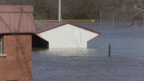 Spring flooding during record warm temperatures and weather conditions Stock Footage 150317242