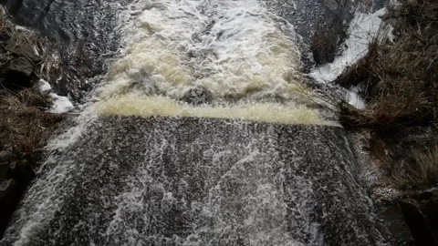 Spring floods.Top down aerial view dirty river with muddy yellow water Stock Footage 151591757