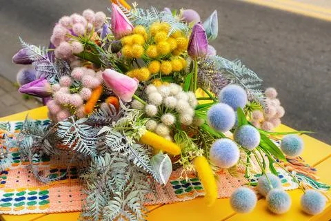 Spring Floral Composition On Yellow Table Roadside Stock Photos