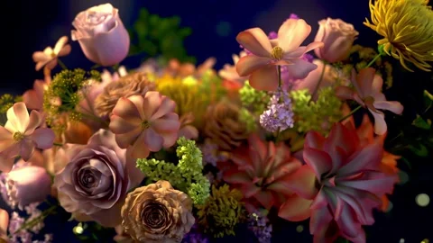 Spring flower bouquet on a dark blue backdrop with delicate particles float.. Stock Footage 296501128