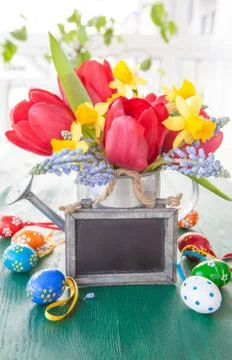 Spring flowers adn easter eggs Stock Photos