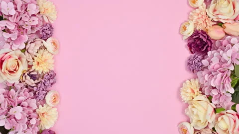 Spring flowers appear on left and right side of pastel pink theme. Stop motion Stock Footage 166371783