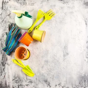 Spring flowers with gardening tools Stock Photos