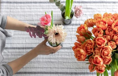 Spring flowers on the table, serving and decoration concept, top view. Stock Photos