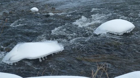 Spring forest river. Melting ice on the river, white snow on the river banks Stock Footage 125292280