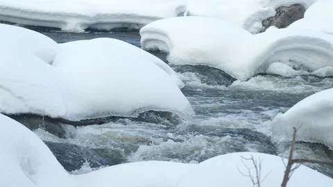Spring forest river. Melting ice on the river, white snow on the river banks Stock Footage 125294301