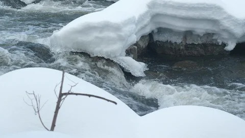 Spring forest river. Melting ice on the river, white snow on the river banks Stock Footage 125296902