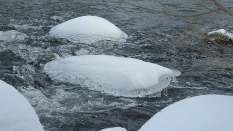 Spring forest river. Melting ice on the river, white snow on the river banks Stock Footage 125300304