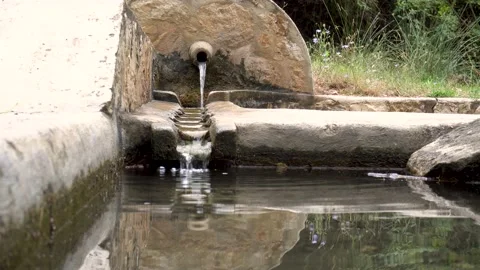 Spring fountain, with a stream of fresh and clear water. Stock Footage 159014334
