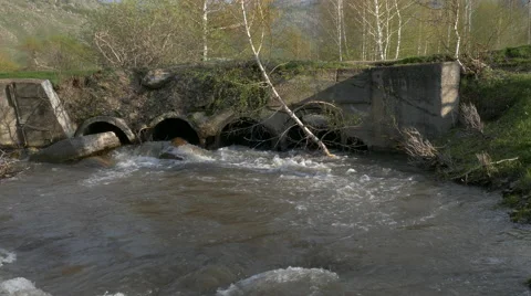 In the spring fresh river flows from pipes Stock Footage 62850753