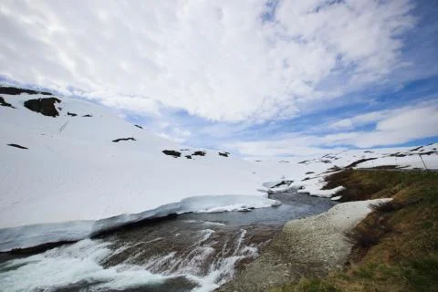 Spring glacial river in mountains Stock Photos
