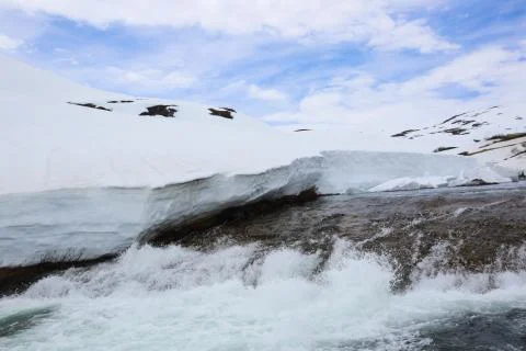 Spring glacial river in mountains Stock Photos