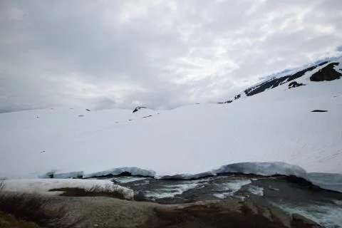 Spring glacial river in mountains Stock Photos