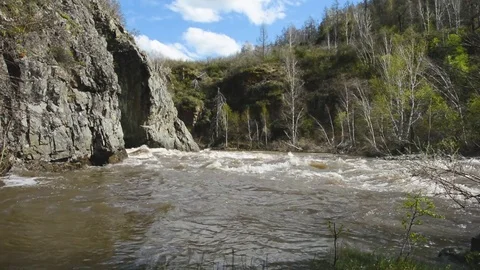 Spring high water flows in the mountain river Ursul Stock Footage 75851073