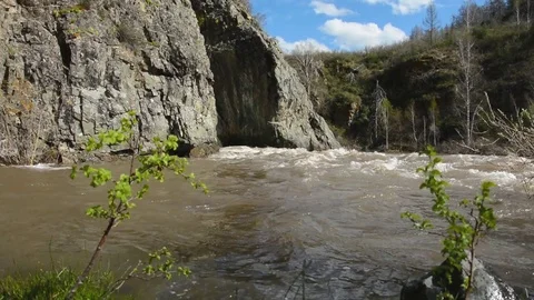 Spring high water flows in the mountain river Ursul Stock Footage 75857524