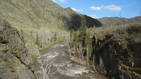 Spring high water flows in the mountain river Ursul Stock Footage 75861933