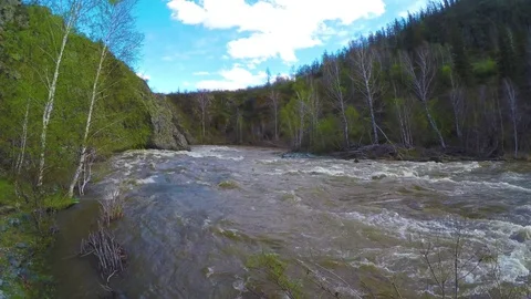 Spring high water flows in the mountain river Ursul. Rocks and water rapids Stock Footage 83236381