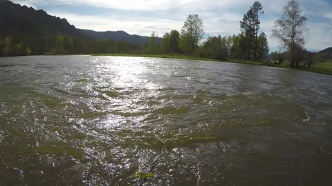 Spring high water flows in the mountain river Ursul. Rocks and water rapids Stock Footage 83244788