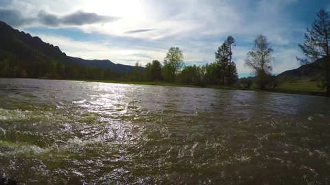 Spring high water flows in the mountain river Ursul. Rocks and water rapids Stock Footage 83254574