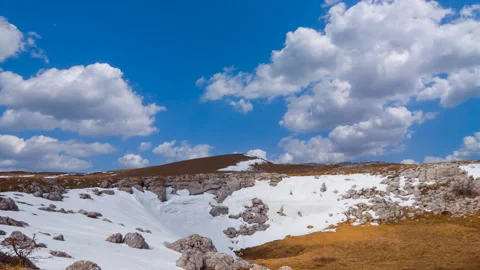 Spring hills in a snow Stock Footage 330115746