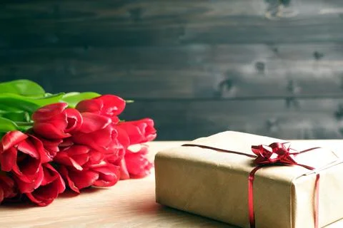 Spring holidays template from gift box, covered by brown craft paper 스톡 사진