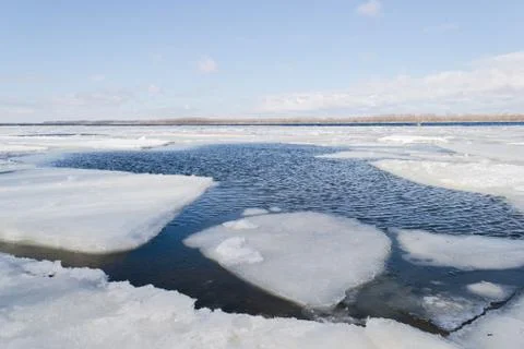 Spring ice drifting on the river. Background texture. Stock Photos