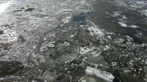 In the spring, ice floes float down the river. Ice drift is the movement of ice Stock Footage 152400009