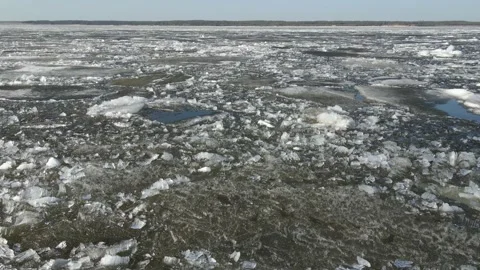 In the spring, ice floes float down the river. Ice drift is the movement of ice Video stock 152563431
