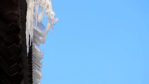 Spring icicles melt blue sky Video stock 74248928
