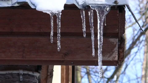 Spring icicles on the roof Stock Footage 235008157
