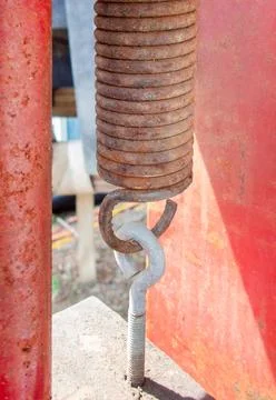 Spring-from-an-industrial-press Stock Photos