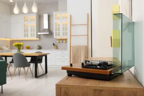 Spring interior. Vintage vinyl record player with disc on wooden surface in.. Stock Illustration