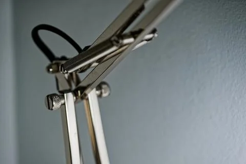 Spring joint on adjustable desk lamp arm in detail Stock Photos