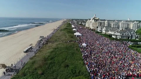 THE SPRING LAKE FIVE MILE RUN "BEGINS" THE SUMMER FOR THOUSANDS Stock Footage 242303934