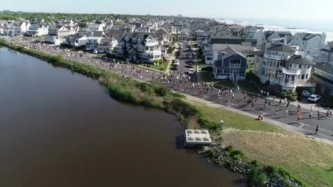 THE SPRING LAKE FIVE MILE RUN - FIELD AROUND SPRING LAKE. Video stock 242304195