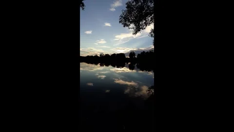 Spring lake landscape trees reflecting in water near Regensburg Germany Stock Footage 328642119