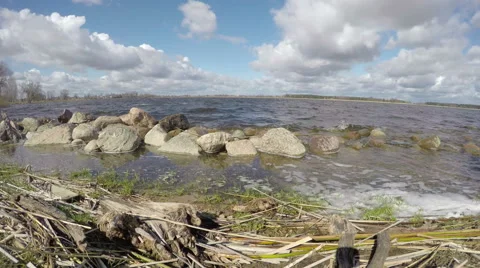 Spring lake landscape with waves and clouds. Timelapse 4K 스톡 동영상 49670129