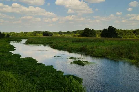 Spring landscape with the Bystrzyca River. Stock Photos