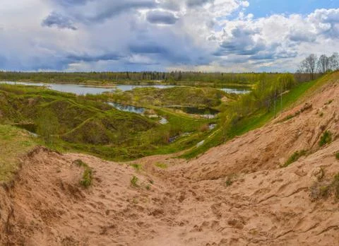 Spring landscape of a closed sand pit. Stock Photos