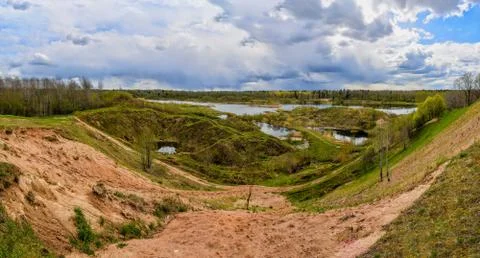 Spring landscape of a closed sand pit. Stock Photos