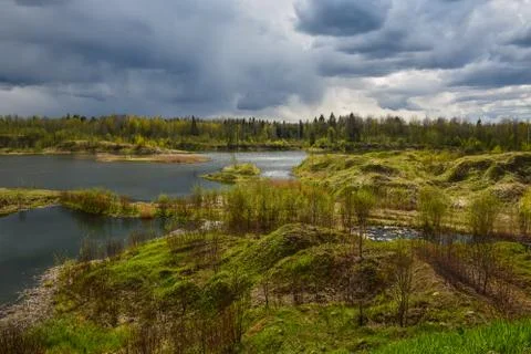 Spring landscape of a closed sand pit. Stock Photos
