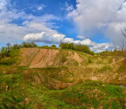 Spring landscape of a closed sand pit. Stock Photos