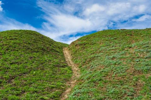 Spring landscape with hiking path uphill to heaven Foto stock