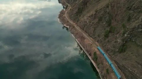 A spring landscape of Lake Baikal with a view of clearwater and a railway Video stock 311851447