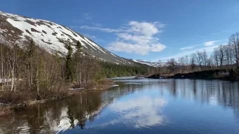 Spring landscape with melting ice on a river in north Scandinavia Stock Footage 135886177