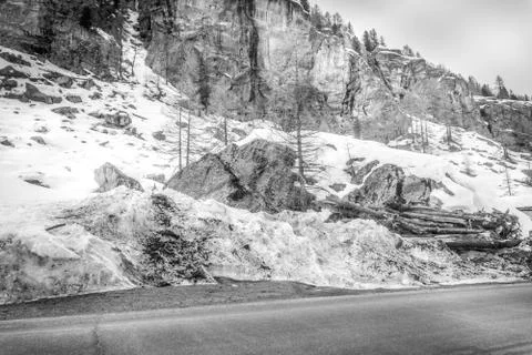 Spring landscape in the mountains in black and white with snow. Bad weather Stock Photos
