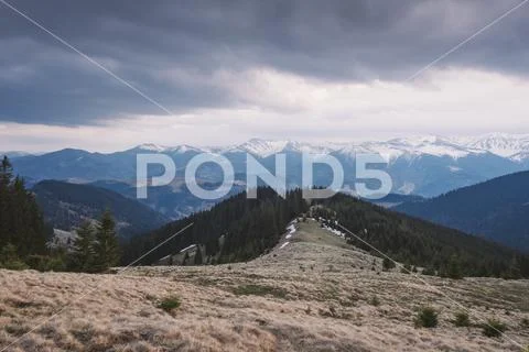Spring landscape with mountains in cloudy weather Stock Photos