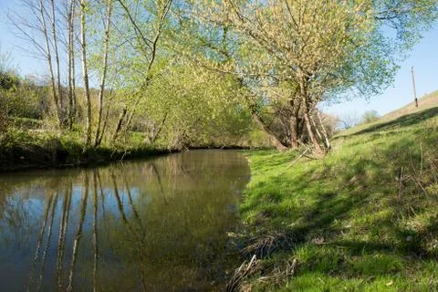 Spring landscape with a river Stock Photos