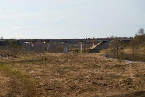 Spring landscape. A road bridge over the river Stock Photos